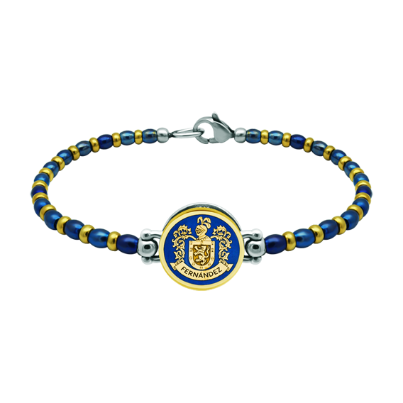 Pulsera heráldica en oro y aceroReferencia: PU2821Pulsera de cadena de bolas de acero y chapadas en oro con el escudo de su apellido tallado bajo relieve en oro de 18 ktes y esmaltado al horno.