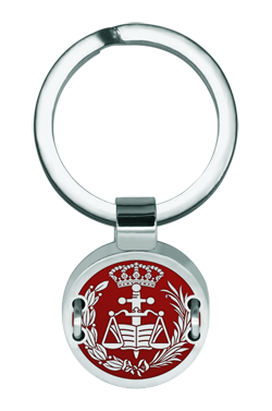 Law School Keychain Made of Silver, Steel, and Aluminum (Red)Ref. code: LL0349Keychain featuring an engraved and enameled aluminum coat of arms representing the legal profession, mounted on polished steel and sewn with silver thread.Size: 18x18mm.