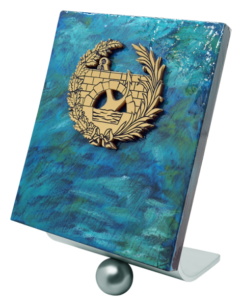 Trophy of professions in enameled slate and steel "Ingenieros de Caminos, Canales y Puertos"Ref. code: PL0458Trophy designed and manufactured exclusively by Joaquín Prior in enameled slate and solid steel, personalized with the golden coat of arms of the Civil Engineers.Possibility of engraving a commemorative text.We create different trophies, awards or commemorative plaques, personalized with any anagram, shield or logo.Size: 150x180mm.